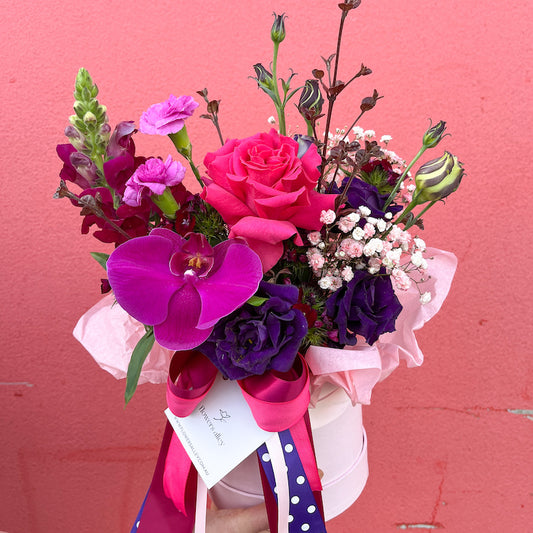 gem tones colour flowers in a ceramic vase