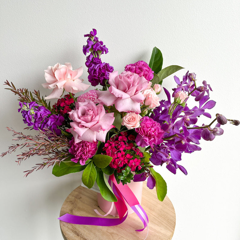 purple and pink flowers in a vase