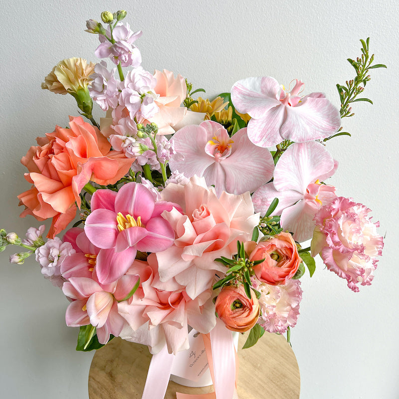 pastel pink and peach flower arrangement